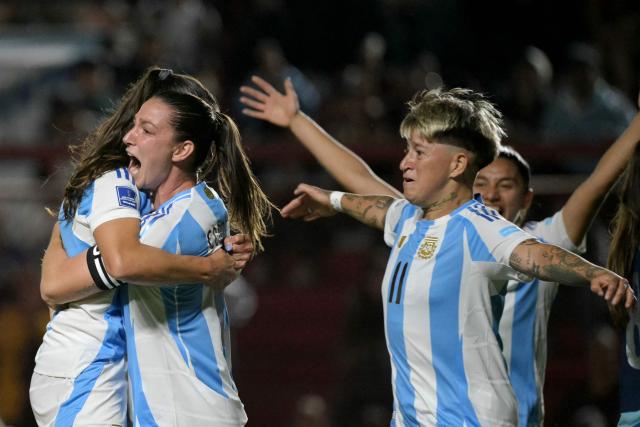 Argentina's defender #06 Aldana Cometti (2nd-L) celebrates with teammates after scoring her team's first goal during the Conmebol Women's Nations League 2025-26 football match between Argentina and Paraguay at the Diego Armando Maradona Stadium in Buenos Aires on October 24, 2025. (Photo by JUAN MABROMATA / AFP)