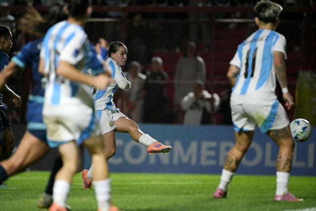 Argentina's forward #19 Agostina Holzheier shoots and scores her team's second goal during the Conmebol Women's Nations League 2025-26 football match between Argentina and Paraguay at the Diego Armando Maradona Stadium in Buenos Aires on October 24, 2025. (Photo by JUAN MABROMATA / AFP)