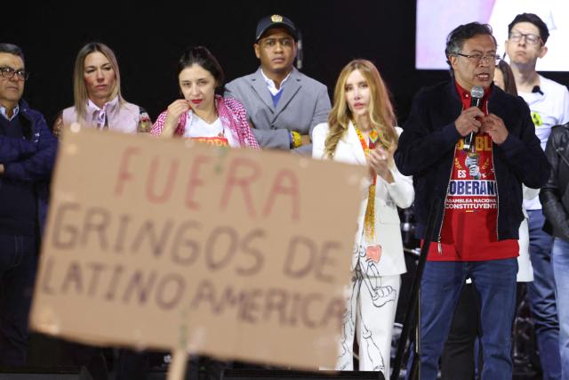 Colombian President Gustavo Petro speaks during a rally at Bolivar Square in Bogota on October 24, 2025. US on Friday announced sanctions on Colombia's President Gustavo Petro, who Washington has accused of failing to curb illicit drug trafficking, alongside his wife and eldest son. (Photo by JOHN VIZCAINO / AFP)