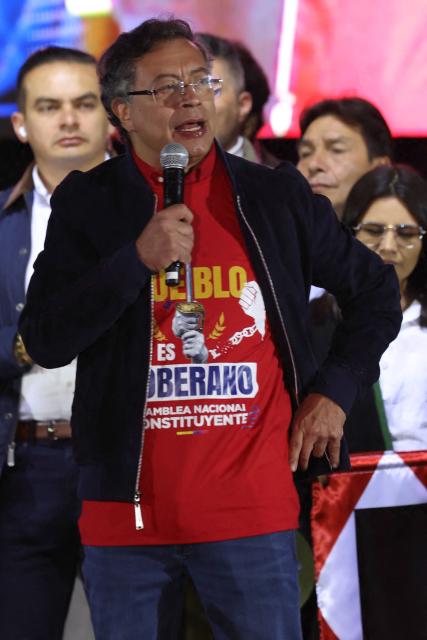 Colombian President Gustavo Petro speaks during a rally at Bolivar Square in Bogota on October 24, 2025. US on Friday announced sanctions on Colombia's President Gustavo Petro, who Washington has accused of failing to curb illicit drug trafficking, alongside his wife and eldest son. (Photo by JOHN VIZCAINO / AFP)