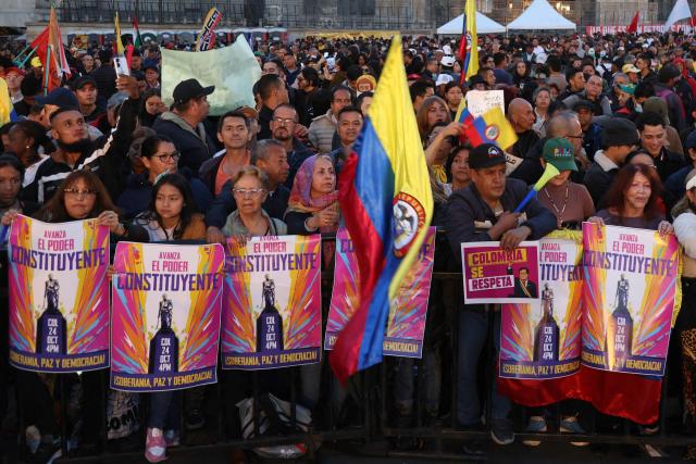 People attend a rally in support of Colombia's President Gustavo Petro at Bolivar Square in Bogota on October 24, 2025. US on Friday announced sanctions on Colombia's President Gustavo Petro, who Washington has accused of failing to curb illicit drug trafficking, alongside his wife and eldest son. (Photo by JOHN VIZCAINO / AFP)