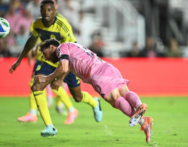 Inter Miami's Argentine forward Lionel Messi heads the ball to score a goal during the Major League Soccer (MLS) playoff football match between Inter Miami and Nashville SC at Chase Stadium in Fort Lauderdale, Florida on October 24, 2025. (Photo by Chandan Khanna / AFP)
