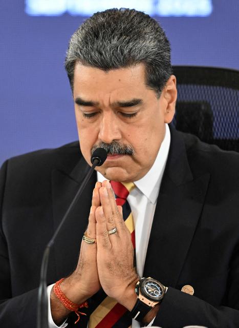 (FILES) Venezuela's President Nicolas Maduro gestures during a press conference in Caracas on September 1, 2025. Venezuela's President Nicolas Maduro asserted on October 24, 2025, that the United States was "fabricating a war" as Washington sent an aircraft carrier to the Caribbean, increasing a military deployment there. (Photo by Juan BARRETO / AFP)