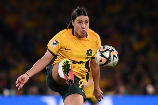 (FILES) Australia's forward #20 Sam Kerr shoots the ball to score her team's first goal during the Australia and New Zealand 2023 Women's World Cup semi-final football match between Australia and England at Stadium Australia in Sydney on August 16, 2023. Record-breaking striker Sam Kerr has vowed to reclaim the captaincy of Australia, declaring she has "so much more to give" in the role. (Photo by FRANCK FIFE / AFP)