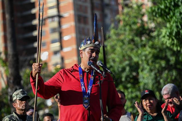 (FILES) Venezuela's President Nicolas Maduro speaks during a march to commemorate the "Day of Indigenous Resistance" in Caracas on October 12, 2025. Venezuela's President Nicolas Maduro asserted on October 24, 2025, that the United States was "fabricating a war" as Washington sent an aircraft carrier to the Caribbean, increasing a military deployment there. (Photo by Federico PARRA / AFP)