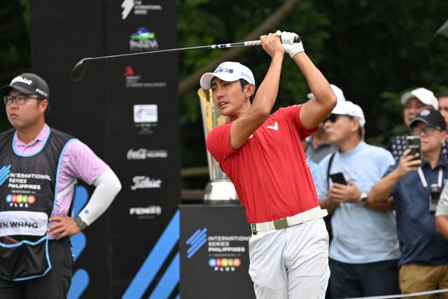 South Korea's Lee Soo-min tees off on hole 1 during the round 3 of the International Series Philippines golf tournament at Sta. Elena Golf Club in Santa Rosa, Laguna province on October 25, 2025.  (Photo by Ted ALJIBE / AFP)