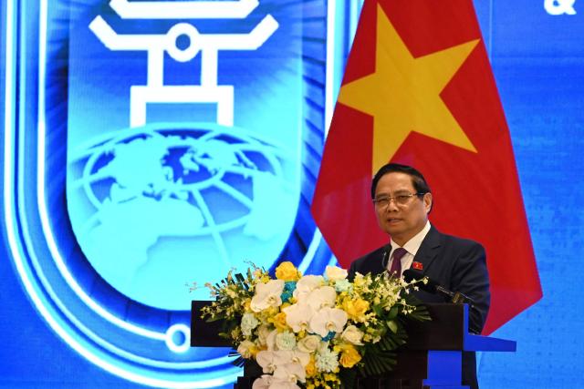 Vietnam's Prime Minister Pham Minh Chinh speaks at a press conference after the signing ceremony of the UN Convention against Cybercrime in Hanoi on October 25, 2025. Countries signed their first UN treaty targeting cybercrime in Hanoi on October 25, despite opposition from an unlikely band of tech companies and rights groups warning of expanded state surveillance. (Photo by Nhac NGUYEN / AFP)