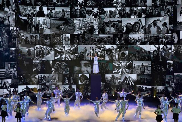 Artists perform at the signing ceremony of the United Nations Convention against Cybercrime in Hanoi on October 25, 2025. Countries signed their first UN treaty targeting cybercrime in Hanoi on October 25, despite opposition from an unlikely band of tech companies and rights groups warning of expanded state surveillance. (Photo by Nhac NGUYEN / AFP)