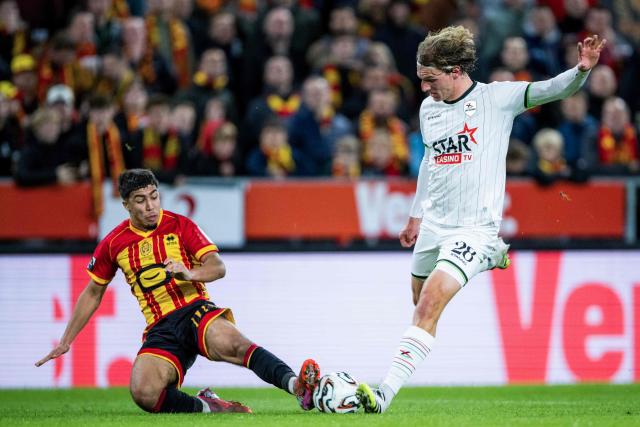 Mechelen's Moncef Zekri (L) fights for the ball with OHL's Ewoud Pletinckx during the Belgian "Pro League" First Division football match between KV Mechelen and Oud-Heverlee Leuven at Achter De Kazerne in Mechelen, on October 25, 2025. (Photo by JASPER JACOBS / BELGA / AFP) / Belgium OUT