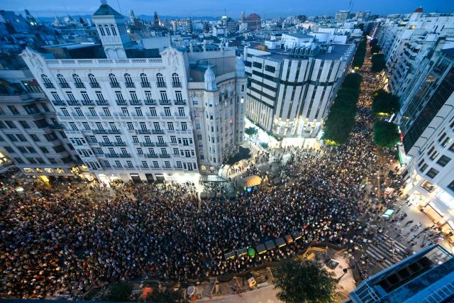 Demonstrators attend a protest to mark the first anniversary of last year's deadly floods and demand accountability in Valencia on October 25, 2025. The protest comes nearly one year since torrential rain on October 29, 2024  caused flooding in towns near Valencia, killing 229 people, Spain's deadliest natural disaster in decades. (Photo by Jose JORDAN / AFP)