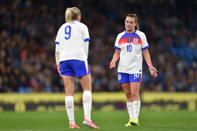 England's striker #09 Alessia Russo (L) and England's midfielder #10 Ella Toone (R) chat during a break in play during the Women's International friendly football match between England and Brazil at The Etihad Stadium in Manchester, north west England on October 25, 2025. (Photo by PETER POWELL / AFP)