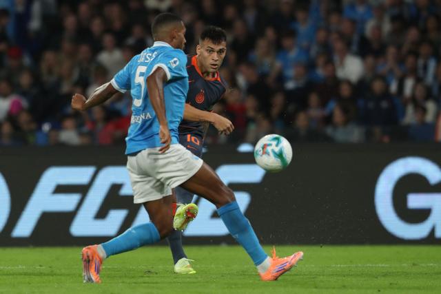 Inter Milan's Argentinian forward #10 Lautaro Martinez fights for the ball with Napoli's Brazilian defender #05 Juan Jesus during the Italian Serie A football match between Napoli and Inter Milan at the Diego Armando Maradona stadium in Naples on October 25, 2025. (Photo by Carlo Hermann / AFP)