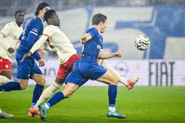Standard Liege's Comorian forward #17 Rafiki Said (2nd R) fights for the ball with KAA Gent's Belgian midfielder #18 Matisse Samoise (R) during the Belgian "Pro League" First Division football match between KAA Gent and Standard Liege at KAA Stadium in Ghent on October 25, 2025. (Photo by Tom Goyvaerts / BELGA / AFP) / Belgium OUT