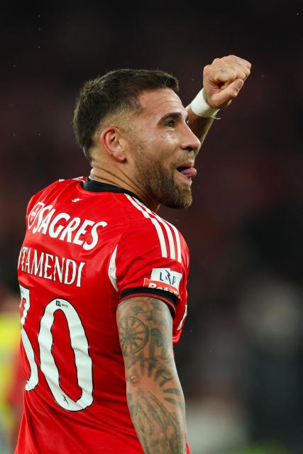 SL Benfica's Argentine defender #30 Nicolas Otamendi celebrates scoring their third goal during the Portuguese League football match between SL Benfica and FC Arouca at Estadio da Luz in Lisbon on October 25, 2025. (Photo by PATRICIA DE MELO MOREIRA / AFP)