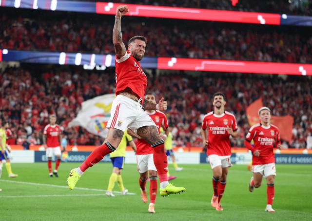 SL Benfica's Argentine defender #30 Nicolas Otamendi jumps in celebration after scoring their third goal during the Portuguese League football match between SL Benfica and FC Arouca at Estadio da Luz in Lisbon on October 25, 2025. (Photo by PATRICIA DE MELO MOREIRA / AFP)