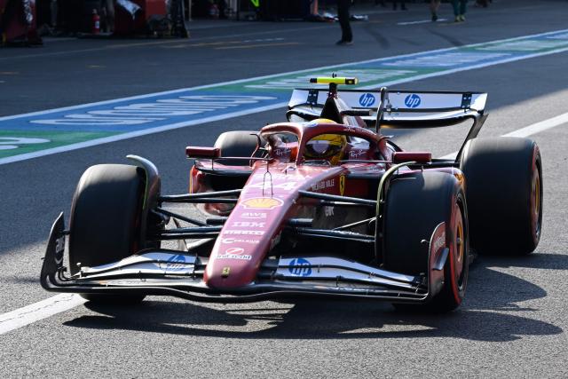 Ferrari's British driver Lewis Hamilton drives through the pit lane during the qualifying session of the Mexico City Formula One Grand Prix at the Hermanos Rodriguez racetrack in Mexico City on October 25, 2025. (Photo by Alfredo ESTRELLA / POOL / AFP)
