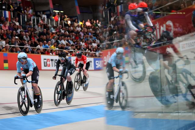 Cyclists compete in the women's madison 30km event final at the 2025 UCI Track World Championships, in the Penalolen Velodrome in Santiago, on October 25, 2025. (Photo by Javier TORRES / AFP)