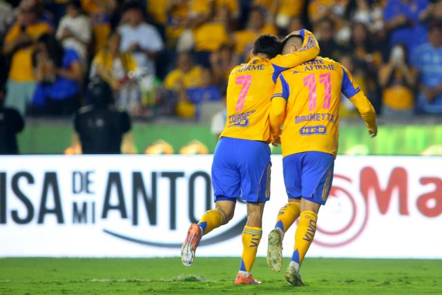 Tigres' Argentine forward #07 Angel Correa celebrates with Tigres' Argentine midfielder #11 Juan Brunetta after scoring during the Liga MX Apertura tournament football match between Tigres and Tijuana at the UANL University Stadium in San Nicolas de los Garza, Nuevo Leon State, Mexico on October 25, 2025. (Photo by Julio Cesar AGUILAR / AFP)
