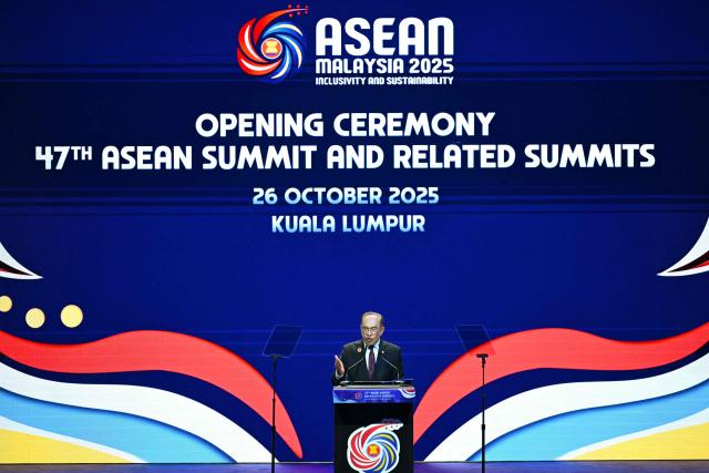 Malaysia's Prime Minister Anwar Ibrahim speaks during the opening ceremony of the 47th Association of Southeast Asian Nations (ASEAN) Summit in Kuala Lumpur on October 26, 2025. (Photo by MOHD RASFAN / AFP)