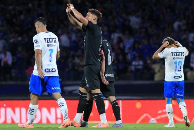 Cruz Azul's defender #05 Jesus Orozco celebrates scoring his team's first goal during the Liga MX Apertura football tournament match between Cruz Azul and Monterrey at the Azteca Stadium in Mexico City on October 25, 2025. (Photo by Victor Cruz / AFP)