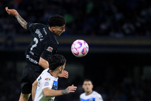 Cruz Azul's defender #02 Jorge Sanchez and Monterrey's defender #03 Gerardo Arteaga fight for the ball during the Liga MX Apertura football tournament match between Cruz Azul and Monterrey at the Azteca Stadium in Mexico City on October 25, 2025. (Photo by Victor Cruz / AFP)
