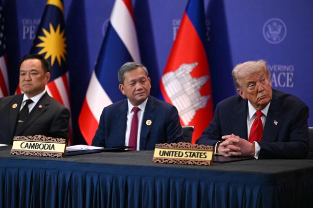 TOPSHOT - US President Donald Trump (R) looks on next to Cambodia's Prime Minister Hun Manet (C) and Thailand's Prime Minister Anutin Charnvirakul (L) as Malaysia's Prime Minister Anwar Ibrahim speaks ahead of the ceremonial signing of a ceasefire agreement on the sidelines of the 47th Association of Southeast Asian Nations (ASEAN) Summit in Kuala Lumpur on October 26, 2025. (Photo by ANDREW CABALLERO-REYNOLDS / AFP)