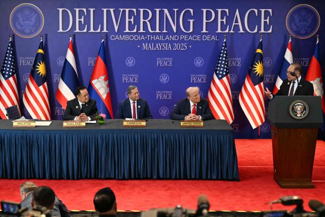 (From L to R) Thailand's Prime Minister Anutin Charnvirakul, Cambodia's Prime Minister Hun Manet and US President Donald Trump listen as Malaysia's Prime Minister Anwar Ibrahim speaks ahead of the ceremonial signing of a ceasefire agreement between Thailand and Cambodia on the sidelines of the 47th Association of Southeast Asian Nations (ASEAN) Summit in Kuala Lumpur on October 26, 2025. (Photo by MOHD RASFAN / POOL / AFP)