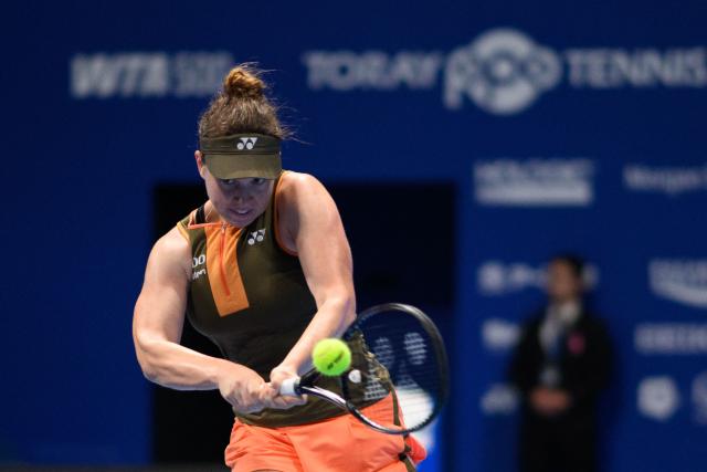 Czech Republic's Linda Noskova hits a return against Switzerland's Belinda Bencic during the women's singles final at the Pan Pacific Open tennis tournament in Tokyo on October 26, 2025. (Photo by Philip FONG / AFP)