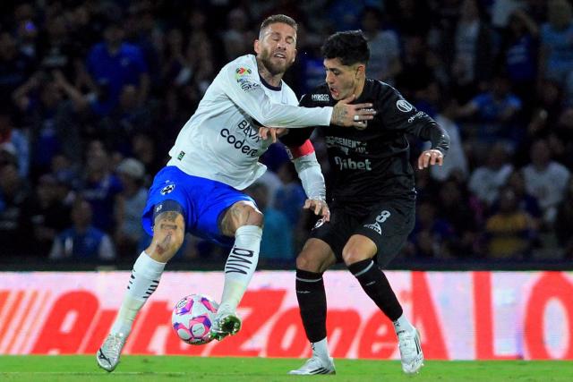 Monterrey's Spanish defender #93 Sergio Ramos and Cruz Azul's defender #03 Omar Campos fight for the ball during the Liga MX Apertura football tournament match between Cruz Azul and Monterrey at the Azteca Stadium in Mexico City on October 25, 2025. (Photo by Victor Cruz / AFP)