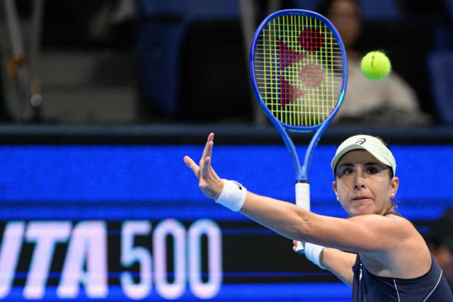 Switzerland's Belinda Bencic hits a return against Czech Republic's Linda Noskova during the women's singles final at the Pan Pacific Open tennis tournament in Tokyo on October 26, 2025. (Photo by Philip FONG / AFP)