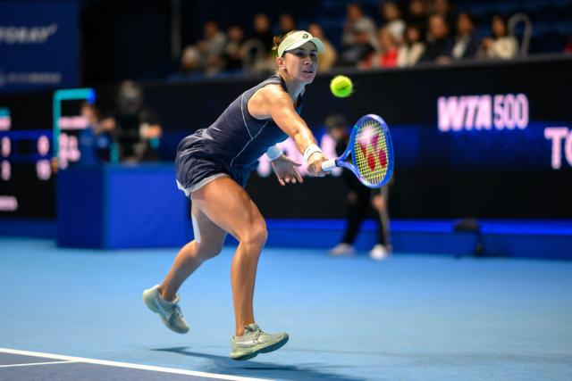 Switzerland's Belinda Bencic hits a return against Czech Republic's Linda Noskova during the women's singles final at the Pan Pacific Open tennis tournament in Tokyo on October 26, 2025. (Photo by Philip FONG / AFP)