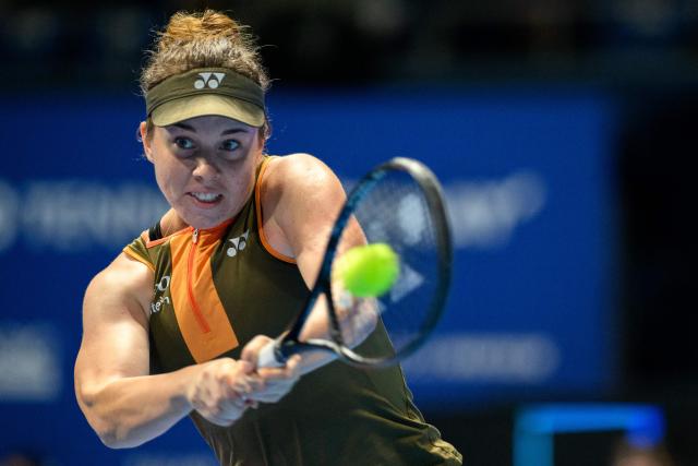 Czech Republic's Linda Noskova hits a return against Switzerland's Belinda Bencic during the women's singles final at the Pan Pacific Open tennis tournament in Tokyo on October 26, 2025. (Photo by Philip FONG / AFP)
