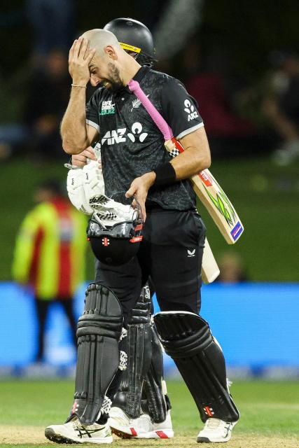 New Zealand's Daryl Mitchell reacts during the first one-day international (ODI) cricket match between New Zealand and England at Bay Oval in Tauranga on October 26, 2025. (Photo by DJ MILLS / AFP)