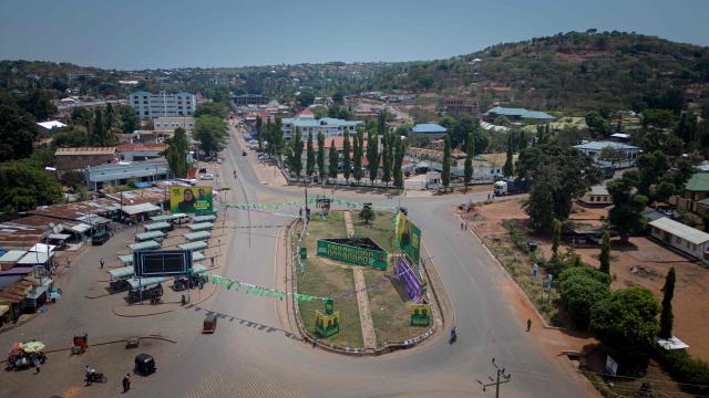 This aerial view shows campaign posters of ruling Tanzanian Chama Cha Mapinduzi (CCM - Revolutionary Party) of the incumbent President Samia Suluhu Hassan in Kigoma town on October 26, 2025. (Photo by AFP)