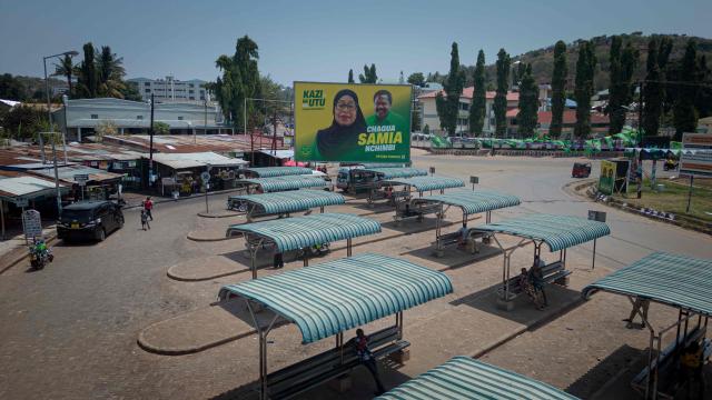 A general view of a billboard of ruling Tanzanian Chama Cha Mapinduzi (CCM - Revolutionary Party) of the incumbent President Samia Suluhu Hassan in Kigoma town on October 26, 2025. (Photo by AFP)