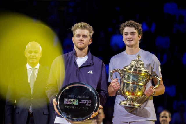 Winner Brazil's Joao Fonseca (R) and Spain's Alejandro Davidovich Fokina pose with their trophies after competing against each other in their men's final match at the Swiss Indoors ATP 500 tennis tournament in Basel on October 26, 2025. (Photo by Fabrice COFFRINI / AFP)