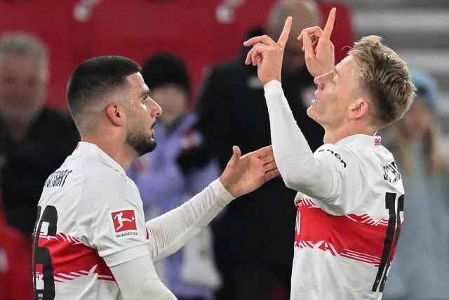 Stuttgart's German midfielder #10 Chris Fuehrich (R) celebrates scoring the 1-1 goal with his teammate Stuttgart's German forward #26 Deniz Undav during the German first division Bundesliga football match VfB Stuttgart v Mainz 05 in Stuttgart, southwestern Germany on October 26, 2025. (Photo by THOMAS KIENZLE / AFP) / DFL REGULATIONS PROHIBIT ANY USE OF PHOTOGRAPHS AS IMAGE SEQUENCES AND/OR QUASI-VIDEO  ALTERNATIVE CROP