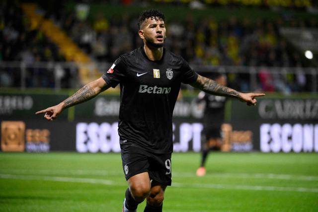 Sporting Lisbon's Colombian forward #97 Luis Suarez celebrates scoring the opening goal during the Portuguese League football match between CD Tondela and Sporting CP at the Joao Cardoso stadium in Tondela on October 26, 2025. (Photo by Miguel RIOPA / AFP)