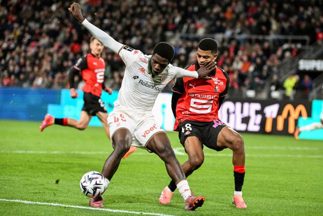 Nice’s Cameroonian #47 Bernard Nguene (L) fights for the ball with Rennes’ Moroccan defender #48 Ait Boudlal (R) during the French L1 football match between Stade Rennais FC and OGC Nice at the Roazhon Park stadium in Rennes, western France, on October 26, 2025. (Photo by Sebastien Salom-Gomis / AFP)