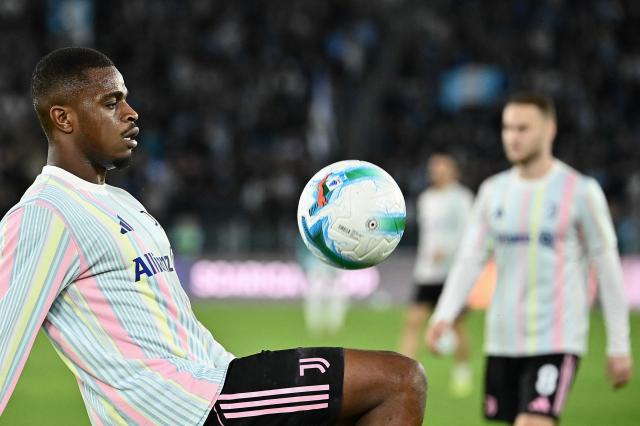Juventus' French defender #15 Pierre Kalulu Kyatengwan warms up ahead of the the Italian Serie A football match between Lazio and Juventus at Olympic stadium in Rome on October 26, 2025. (Photo by Isabella BONOTTO / AFP)
