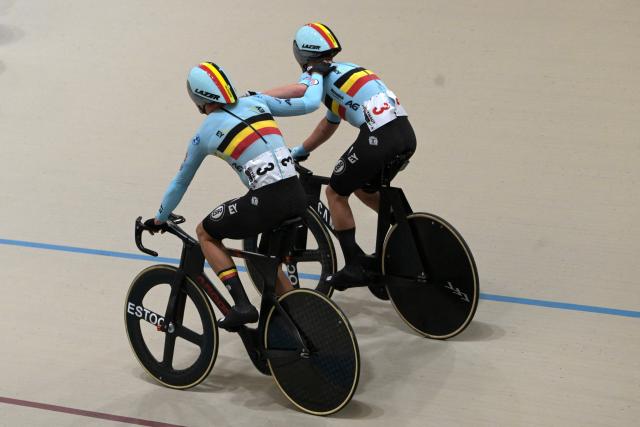 Belgium's Lindsay De Vylder (L) and Fabio Van den Bossche celebrate after winning gold in the men's madison 50km event final at the 2025 UCI Track World Championships, in the Penalolen Velodrome in Santiago, on October 26, 2025. (Photo by Rodrigo ARANGUA / AFP)