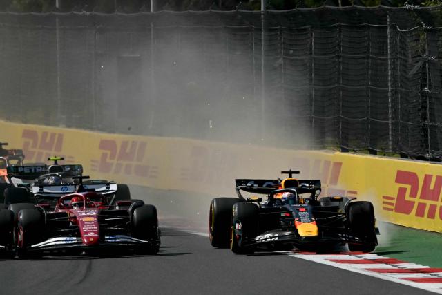 Red Bull Racing's Dutch driver Max Verstappen (R) races ahead of Ferrari's Monegasque driver Charles Leclerc (L) during the Mexico City Formula One Grand Prix at the Hermanos Rodriguez racetrack in Mexico City on October 26, 2025. (Photo by Carl DE SOUZA / AFP)