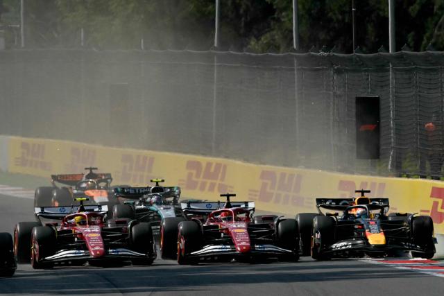 (L-R) Ferrari's British driver Lewis Hamilton, Ferrari's Monegasque driver Charles Leclerc, and Red Bull Racing's Dutch driver Max Verstappen race during the Mexico City Formula One Grand Prix at the Hermanos Rodriguez racetrack in Mexico City on October 26, 2025. (Photo by Carl DE SOUZA / AFP)