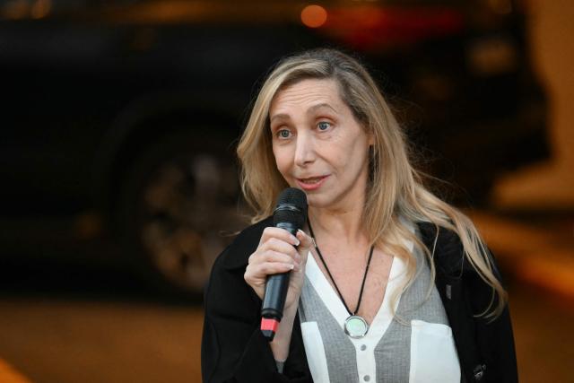 Argentina's General Secretary of the Presidency Karina Milei speaks to the press outside the ruling party's La Libertad Avanza headquarters during the national midterm legislative election, in Buenos Aires on October 26, 2025. Argentines head to the polls for a midterm election that will determine whether President Javier Milei enters the second half of his term bolstered or diminished as economic troubles abound despite unprecedented US aid. (Photo by Luis ROBAYO / AFP)