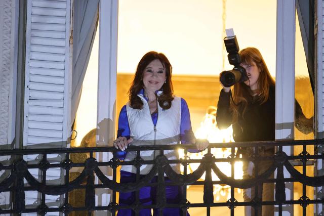 Argentina's former President (2007-2015), Cristina Fernandez de Kirchner, looks on from the balcony of her residence following the results of the national midterm legislative election in Buenos Aires on October 26, 2025. Argentina's budget-slashing leader Javier Milei pulled off a stunning win in Sunday's midterm elections, boosting the flagging reform agenda of the US-backed right-winger. (Photo by Emiliano Lasalvia / AFP)