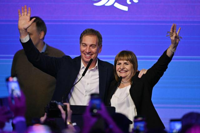 Minister of National Security and candidate for Senator, Patricia Bullrich and Diego Santilli celebrate at the ruling party's La Libertad Avanza headquarters following the results of the national midterm legislative election in Buenos Aires on October 26, 2025. Argentina's budget-slashing leader Javier Milei pulled off a stunning win in Sunday's midterm elections, boosting the flagging reform agenda of the US-backed right-winger. (Photo by Luis ROBAYO / AFP)