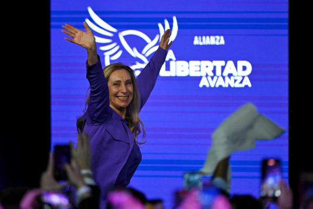 General Secretary of the Presidency of Argentina Karina Milei waves to supporters as she celebrates at the ruling party's La Libertad Avanza headquarters following the results of the national midterm legislative election in Buenos Aires on October 26, 2025. Argentina's budget-slashing leader Javier Milei pulled off a stunning win in Sunday's midterm elections, boosting the flagging reform agenda of the US-backed right-winger. (Photo by Luis ROBAYO / AFP)