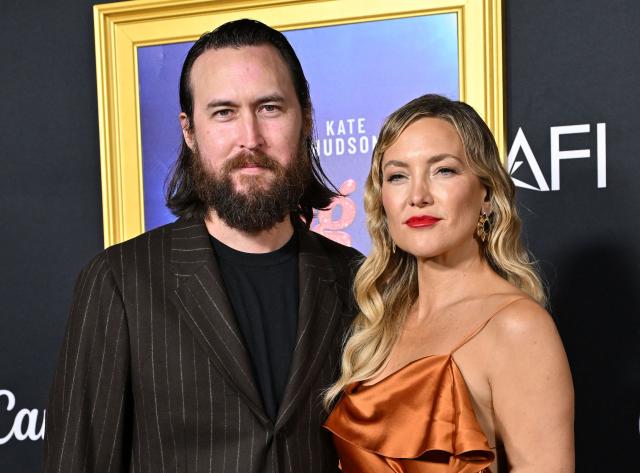 US musician Danny Fujikawa (L) and US actress Kate Hudson attend the world premiere of Focus Features’ "Song Sung Blue" during the AFI Fest at the TCL Chinese Theatre in Hollywood, California on October 26, 2025. (Photo by LISA O'CONNOR / AFP)