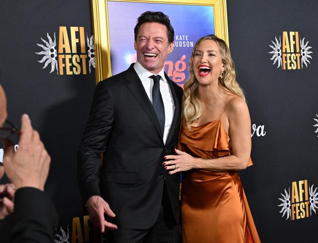 Australian actor Hugh Jackman (L) nd US actress Kate Hudson attend the world premiere of Focus Features’ "Song Sung Blue" during the AFI Fest at the TCL Chinese Theatre in Hollywood, California on October 26, 2025. (Photo by LISA O'CONNOR / AFP)
