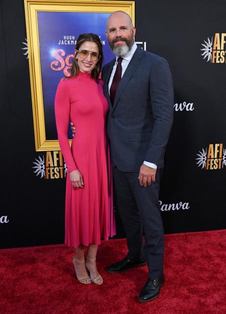 Swedish actress Mercedes Mason (L) and husband US actor David Denman attendthe world premiere of Focus Features’ "Song Sung Blue" during the AFI Fest at the TCL Chinese Theatre in Hollywood, California on October 26, 2025. (Photo by LISA O'CONNOR / AFP)